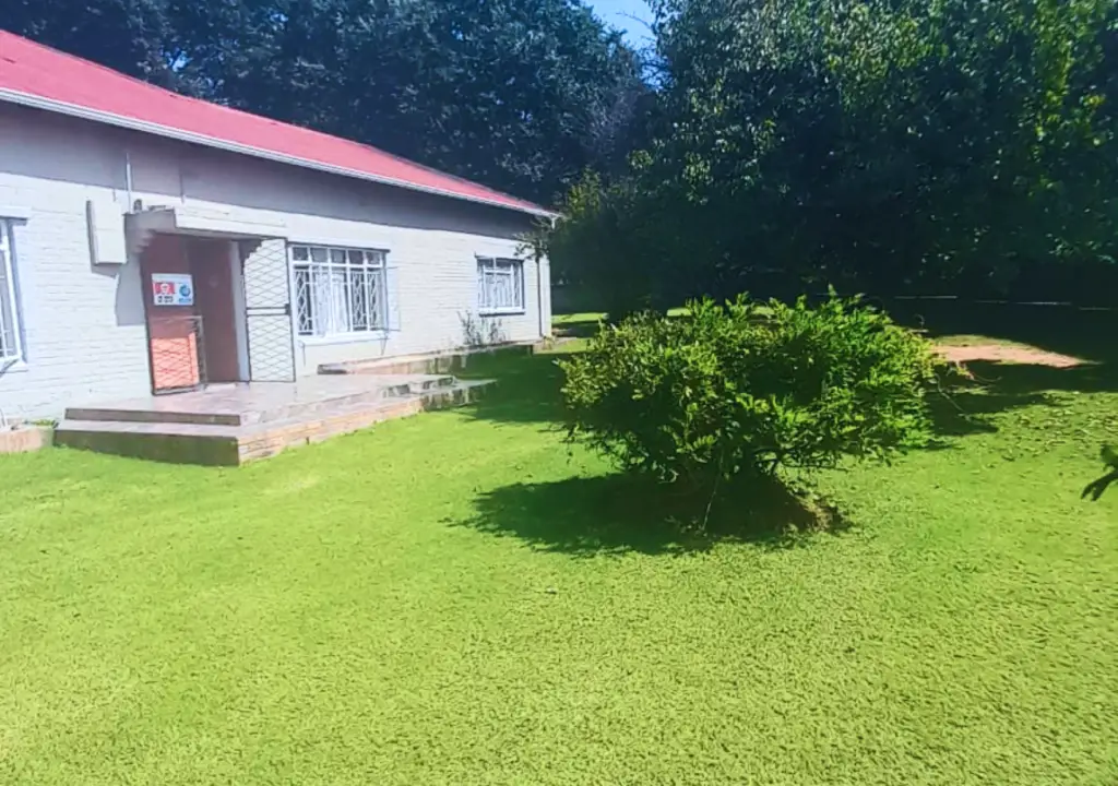 Tranquil garden space at Alika Guest House in Benoni, featuring lush plants, seating areas, and peaceful surroundings for guests